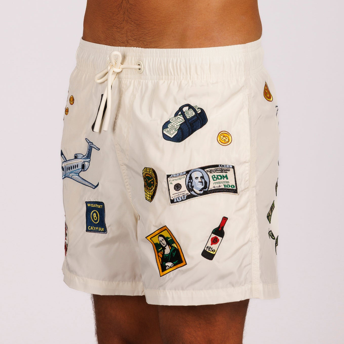 Off-white swim shorts side view with illustrated graphic