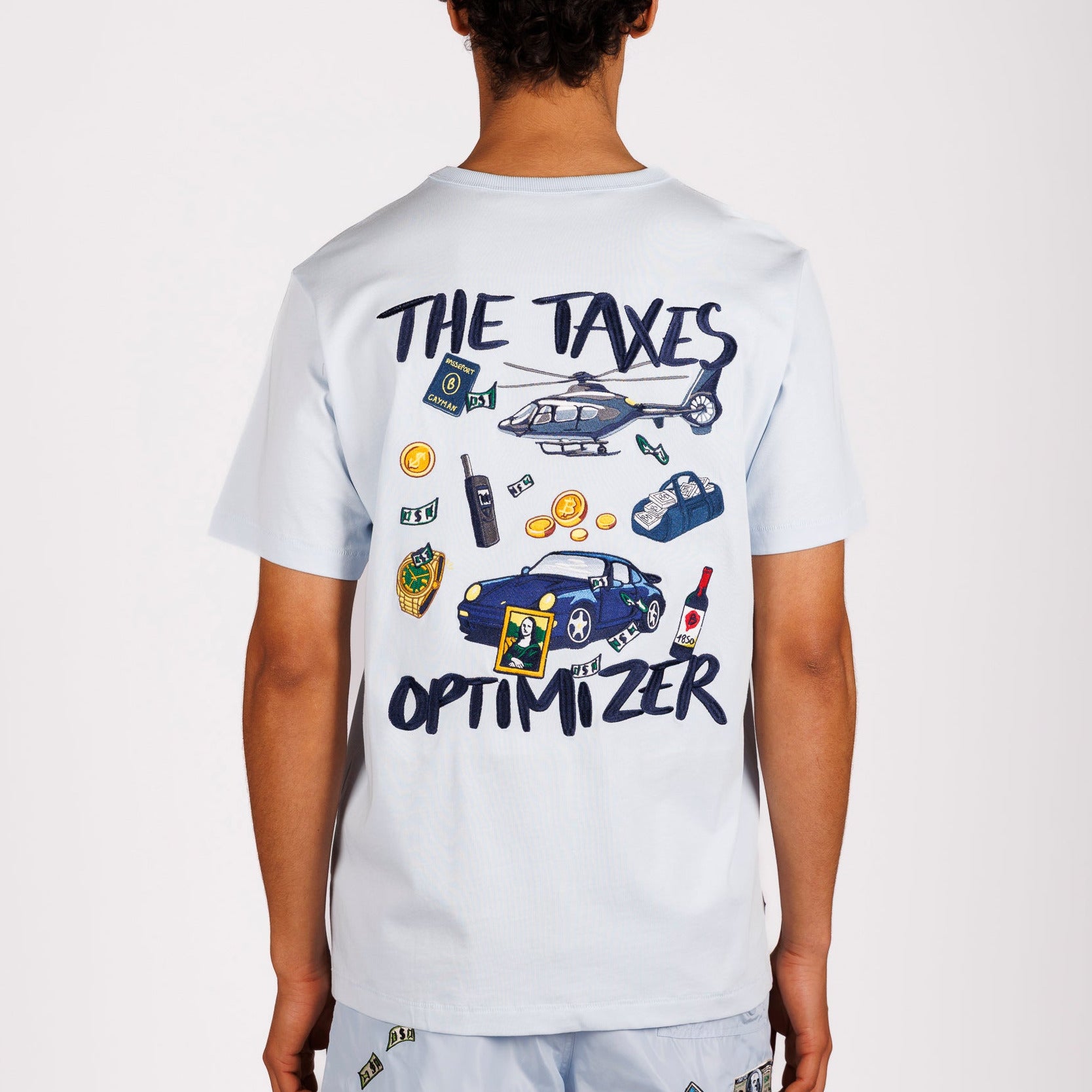 Light blue T-shirt back view with illustrated graphic and “The taxes optimizer” text