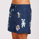 Navy blue swim shorts side view with illustrated graphic