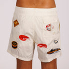 Off-white swim shorts back view with illustrated graphic