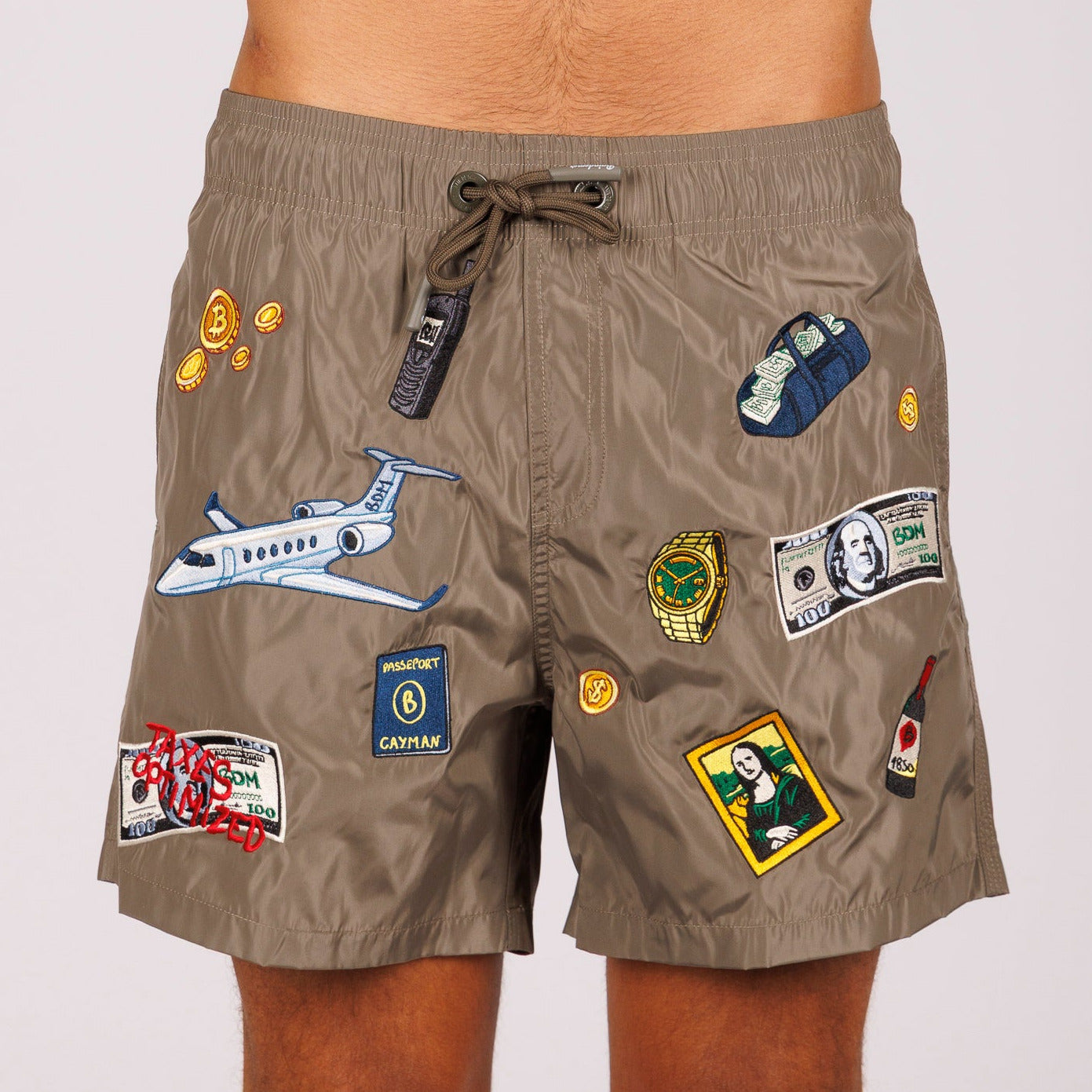 Khaki swim shorts front view with illustrated graphic and “Taxes optimized” text