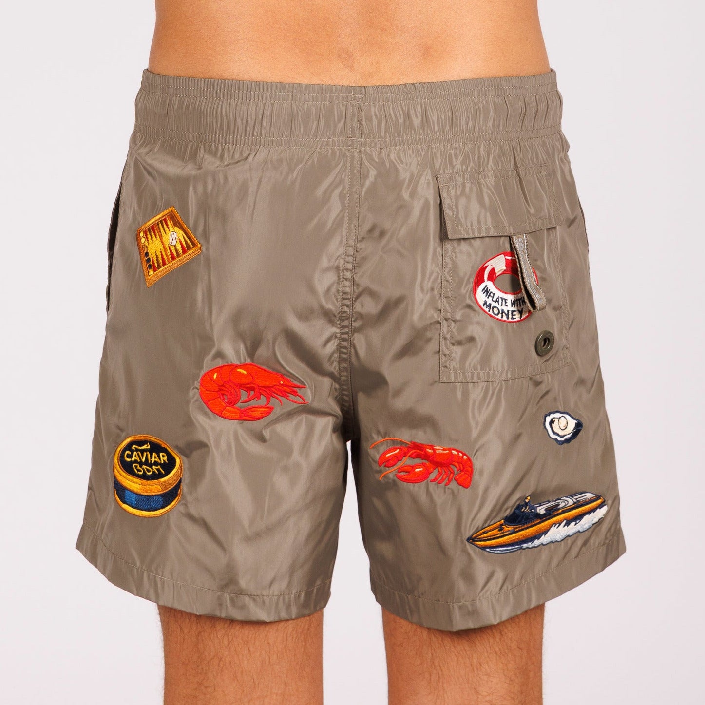 Khaki swim shorts back view with illustrated graphic