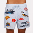Light blue swim shorts front view with illustrated graphic and “Yacht connoisseur” text