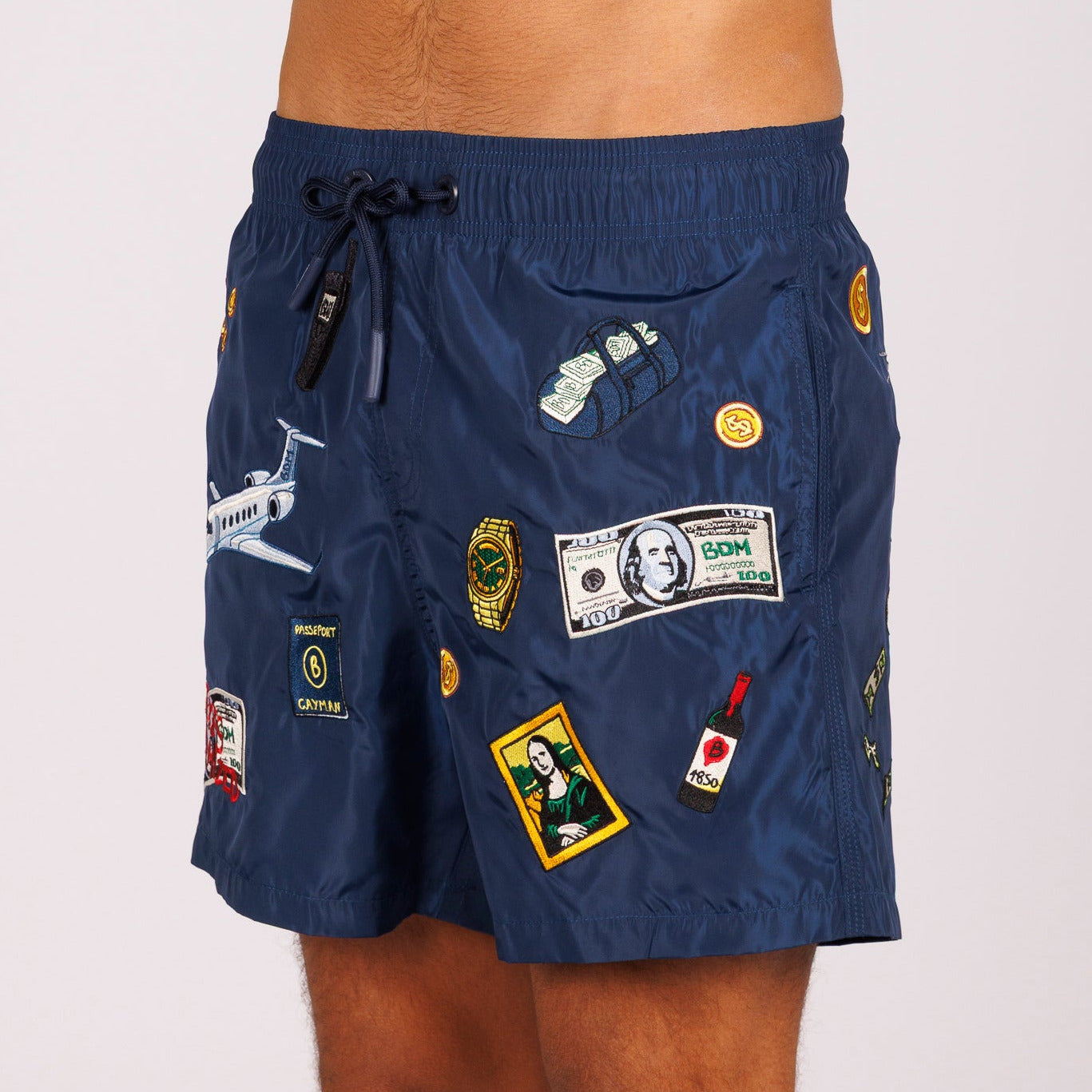 Navy blue swim shorts side view with illustrated graphic
